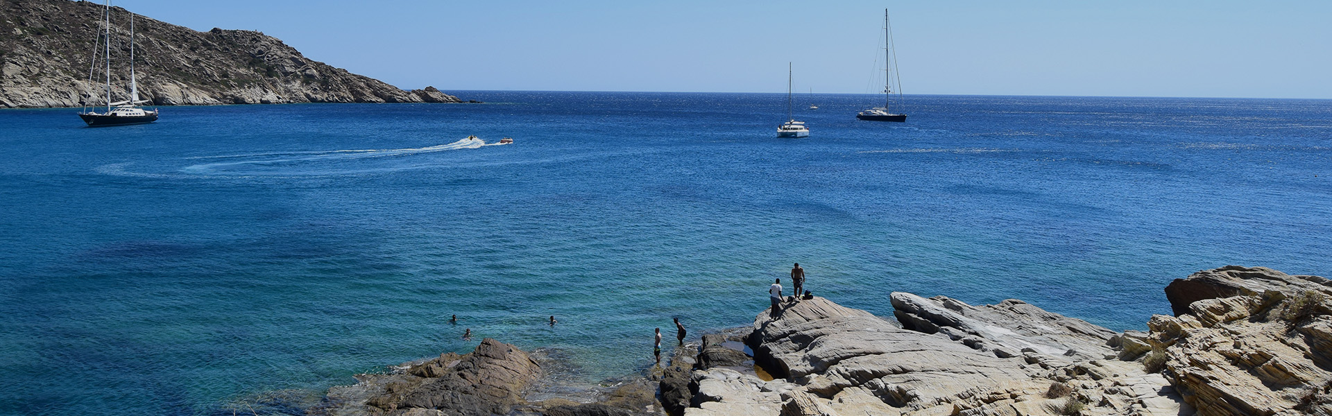 Rocky coastline and clear blue water on the island of Ios